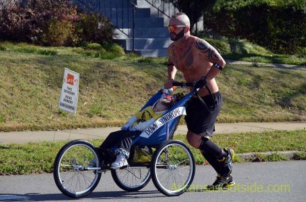 We dubbed this guy the most awesome dad in the race but wonder about the whole story.