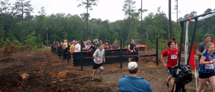 The first obstacle on the course, over a short wall, under a fence over and over.