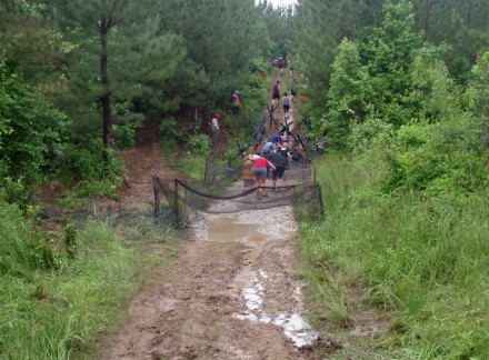 05-12-12_7146 This one consisted of wading through mud under a net and then working your way around some obstacles while trying to keep from sliding or getting shirts caught on the barbed-wire.