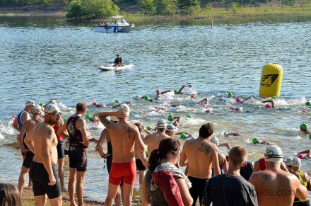 The first wave of swimmers take off.