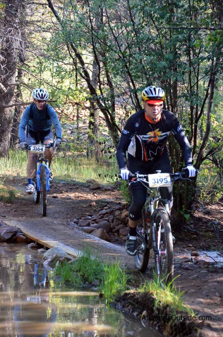 LT100J_0186 Riders negotiate a small bridge before getting on the road.