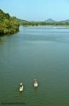 Stand Up Paddleboarding with Pinnacle Mountain in the background.
