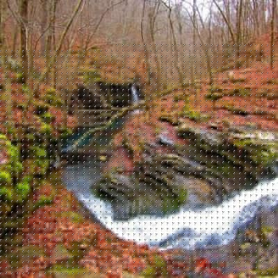 Water rushes with pounding force through a deeply eroded gash in Bear Creek Canyon, in north central Arkansas.