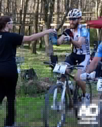 Team Orbea/Tuff Shed rider, Frank Webber, getting fed.