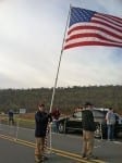 Marvin proudly displays the flag at many local races.