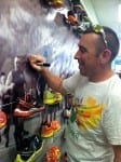 David Langford autographing above his picture on the mural.