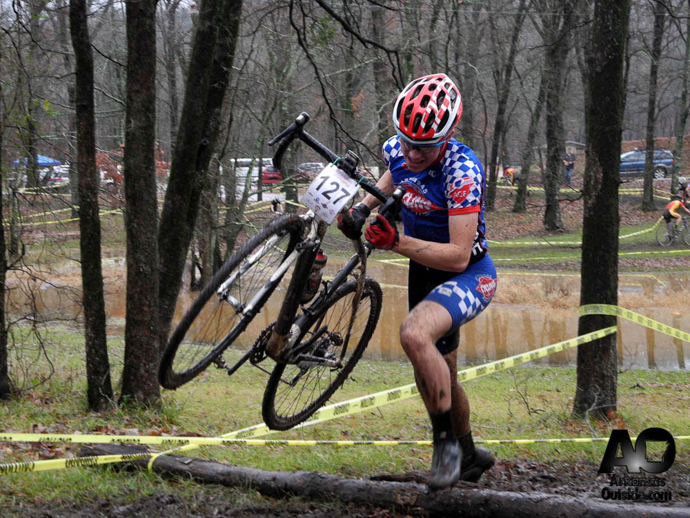 StateCX2012-375 Alex Bumpers of Team Arkansas Cycling & Fitness hurdles the log barriers.