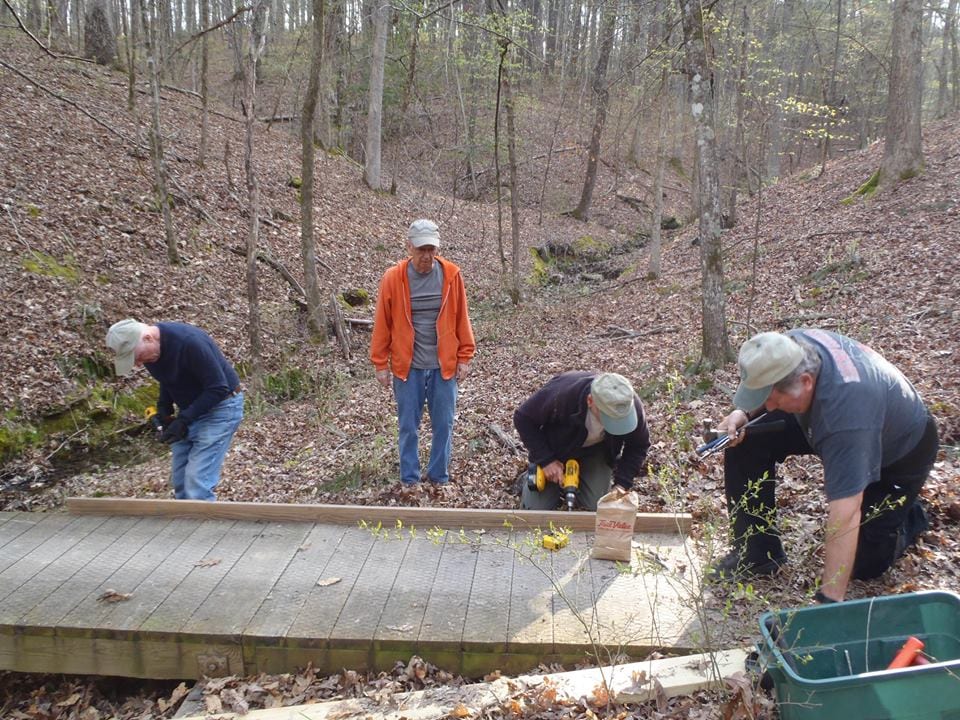 Trail Dogs working on a bridge along the Lake Ouachita Vista Trail.