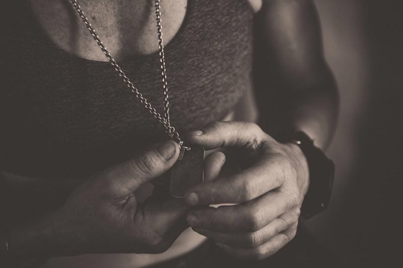 Rebecca Rusch reflects over her father's dog tags, Laos, March 8, 2015.