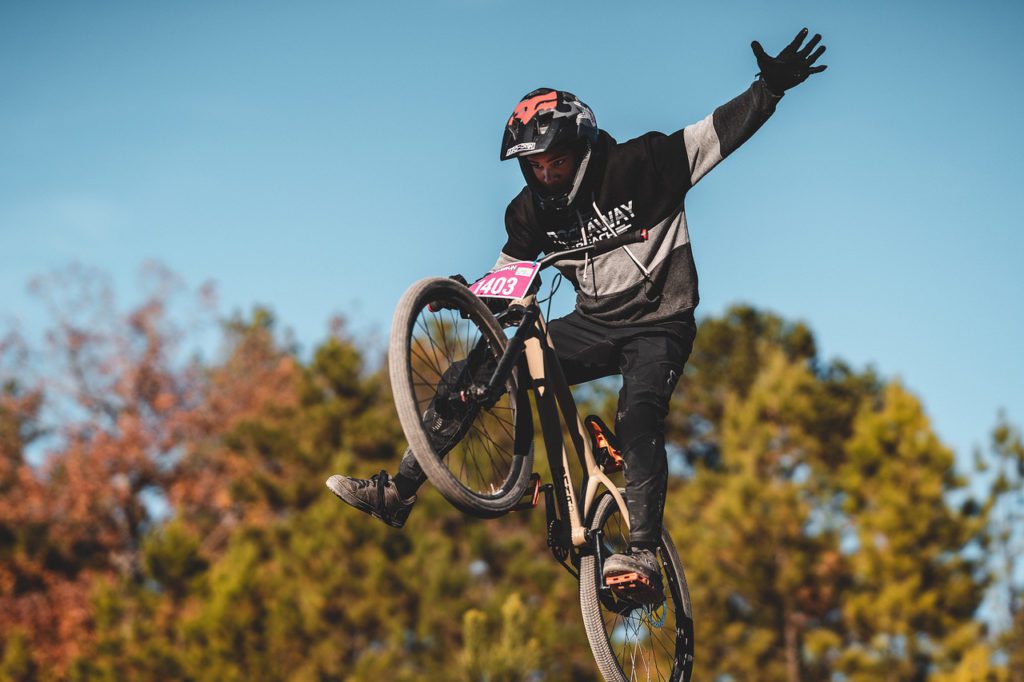 Loic Chabu of Missouri grabs some air as part of the Jump Jam event in the 2021 Güdrun Mountain Bike Festival in Hot Springs.
